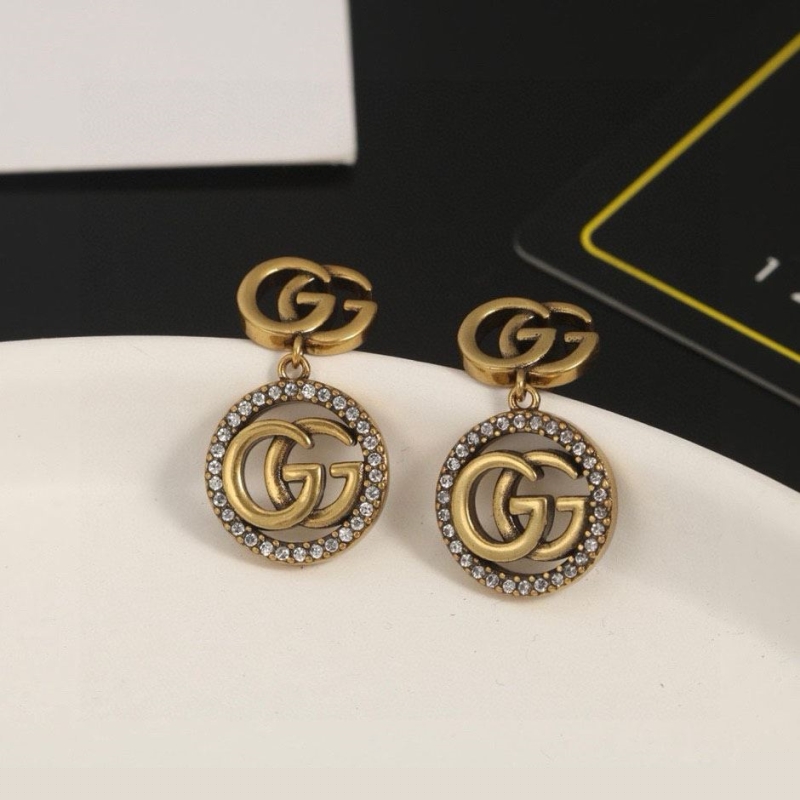 G*u*i earrings